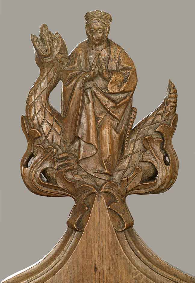 Bench end depicting St Margaret